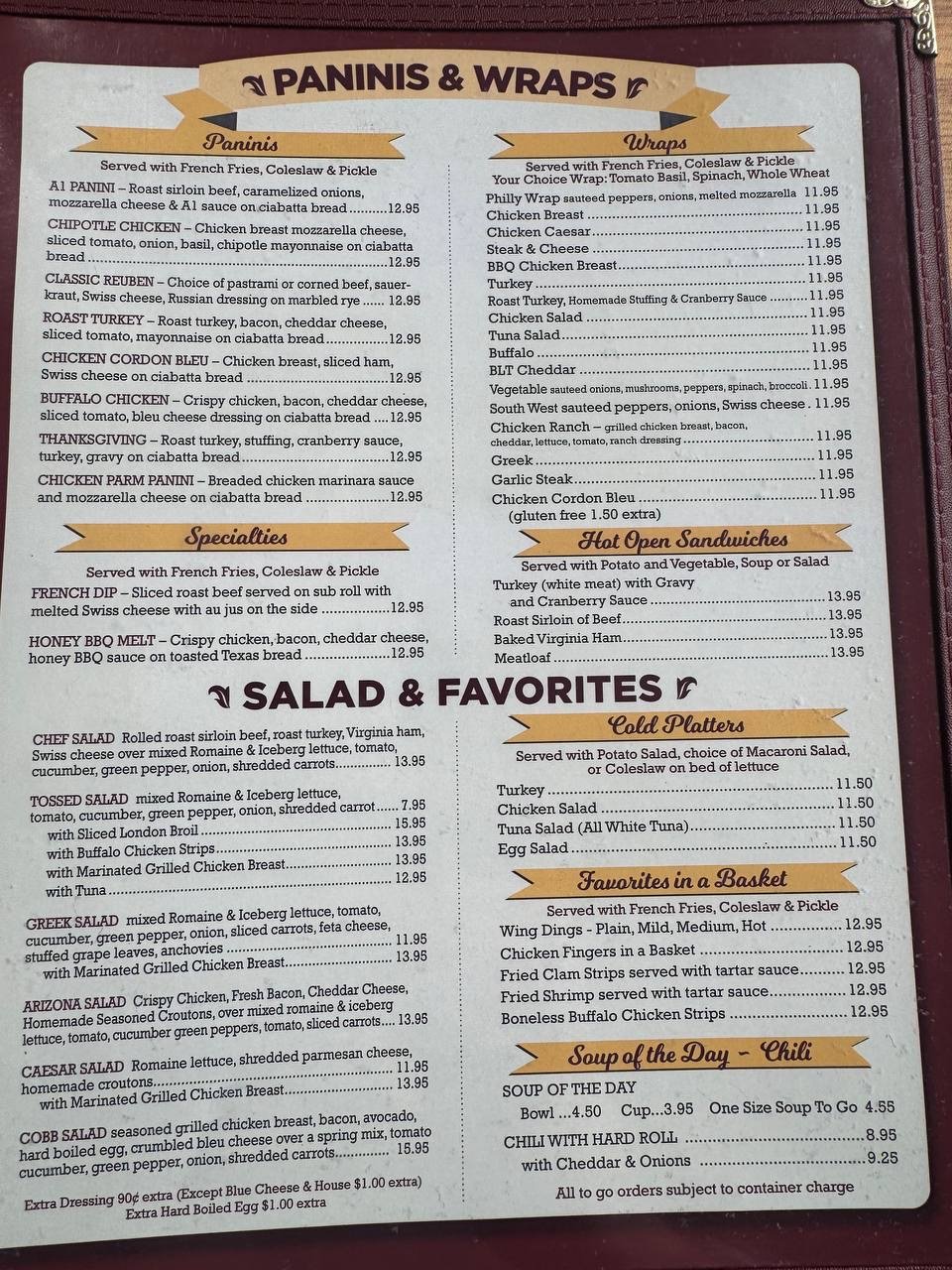 Printed menu with diner breakfast and sandwich sections.